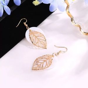 Gold leaf w white circle background drop earrings